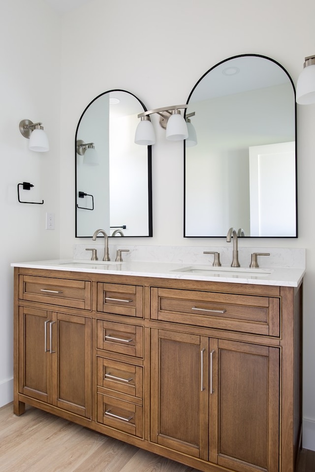 bathroom featuring vanity and hardwood / wood-style flooring