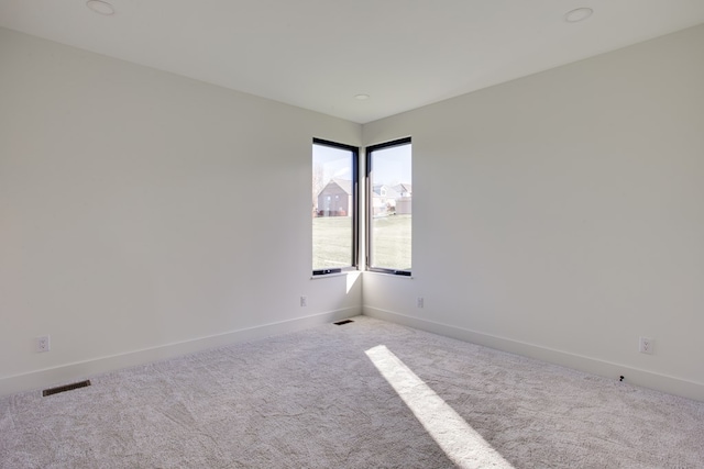 empty room with light colored carpet