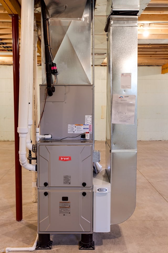 utility room featuring heating unit