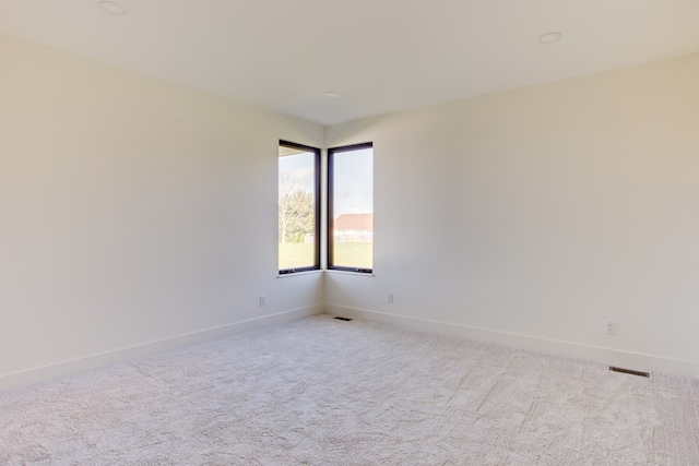 empty room with light colored carpet