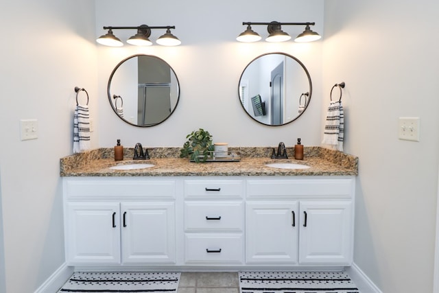 122 Woodside Blvd, Lexington, OH 44904 - full bathroom featuring double vanity, baseboards, and tile patterned flooring