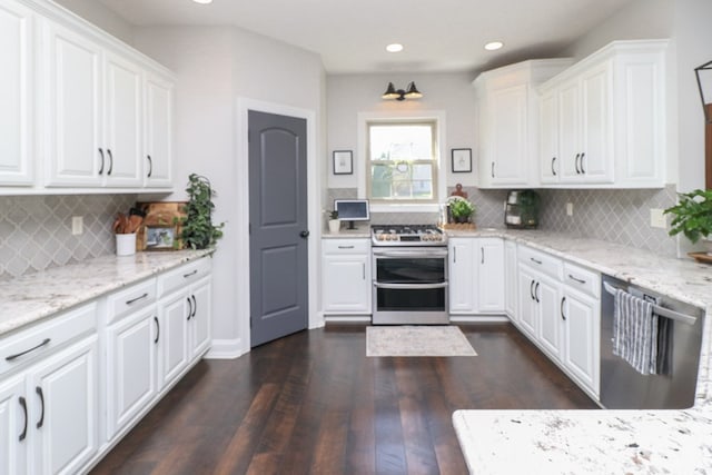 122 Woodside Blvd, Lexington, OH 44904 - kitchen featuring appliances with stainless steel finishes, dark wood finished floors, white cabinetry, backsplash, and recessed lighting