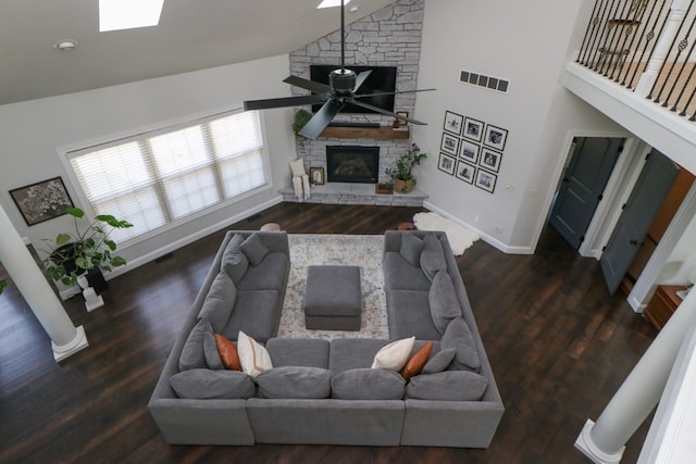 122 Woodside Blvd, Lexington, OH 44904 - living room with high vaulted ceiling, a stone fireplace, baseboards, wood finished floors, and ceiling fan
