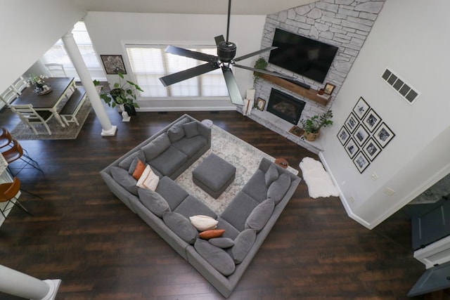 122 Woodside Blvd, Lexington, OH 44904 - living room with a fireplace, a ceiling fan, baseboards, wood finished floors, and ornate columns