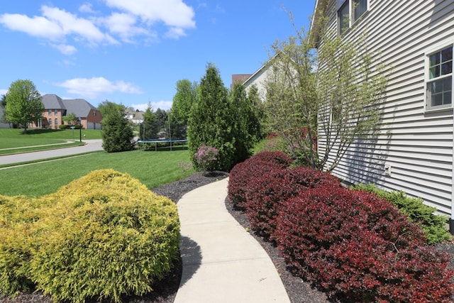 122 Woodside Blvd, Lexington, OH 44904 - view of green lawn featuring a trampoline and a residential view
