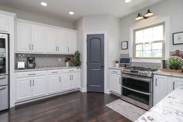 122 Woodside Blvd, Lexington, OH 44904 - kitchen with double oven range, decorative backsplash, white cabinetry, dark wood-type flooring, and recessed lighting