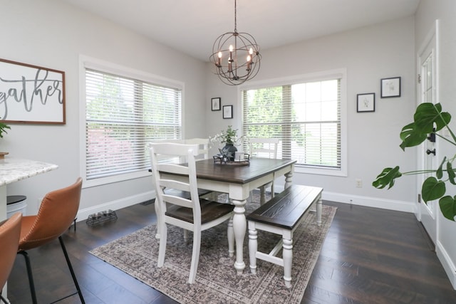 122 Woodside Blvd, Lexington, OH 44904 - dining room featuring a chandelier, baseboards, and wood finished floors