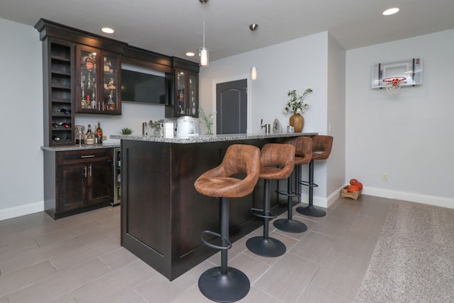 122 Woodside Blvd, Lexington, OH 44904 - indoor wet bar with hanging light fixtures, recessed lighting, and baseboards