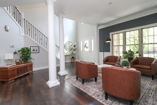 122 Woodside Blvd, Lexington, OH 44904 - living area featuring ornate columns, wood finished floors, stairs, and ornamental molding