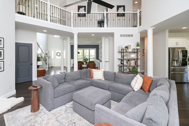 122 Woodside Blvd, Lexington, OH 44904 - living area with decorative columns, wood finished floors, a towering ceiling, a ceiling fan, and recessed lighting