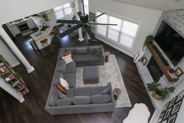 122 Woodside Blvd, Lexington, OH 44904 - living room featuring a stone fireplace, ceiling fan, and wood finished floors