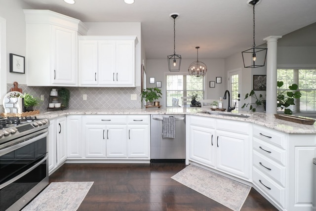 122 Woodside Blvd, Lexington, OH 44904 - kitchen with stainless steel appliances, a sink, plenty of natural light, decorative backsplash, and recessed lighting