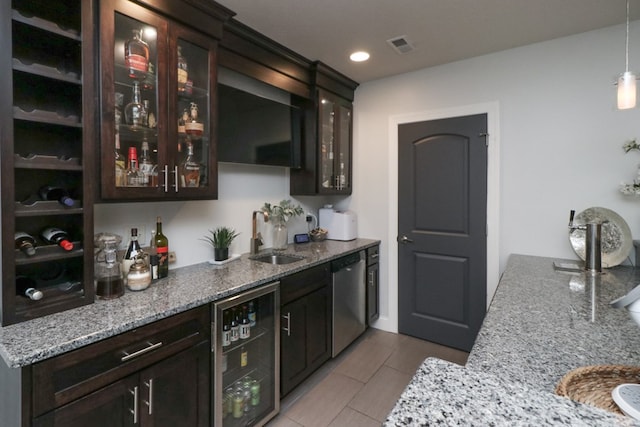 122 Woodside Blvd, Lexington, OH 44904 - indoor wet bar with wine cooler, stainless steel dishwasher, light tile patterned floors, hanging light fixtures, and recessed lighting