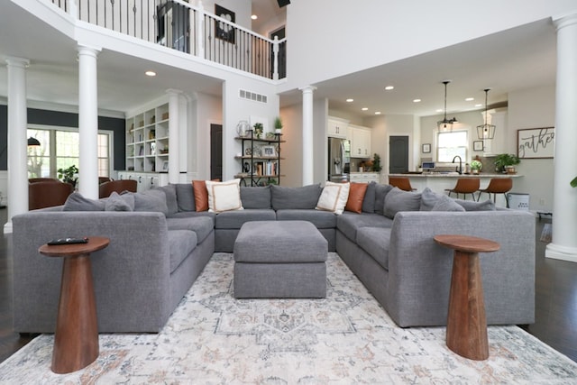 122 Woodside Blvd, Lexington, OH 44904 - living area with decorative columns, recessed lighting, and a high ceiling