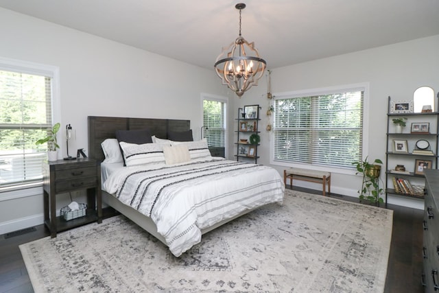 122 Woodside Blvd, Lexington, OH 44904 - bedroom featuring a chandelier, baseboards, and wood finished floors