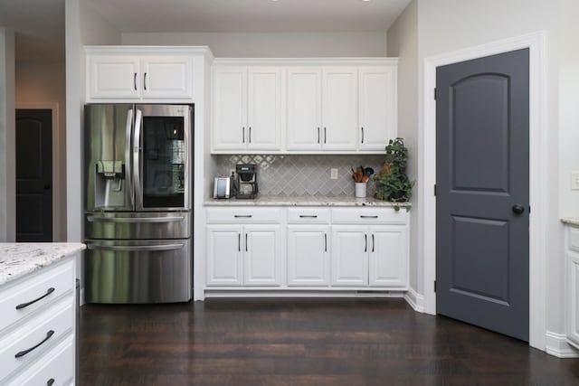 122 Woodside Blvd, Lexington, OH 44904 - kitchen featuring stainless steel fridge with ice dispenser, backsplash, white cabinetry, and light stone countertops