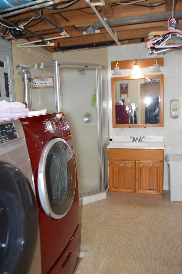 clothes washing area with cabinets, light carpet, washing machine and dryer, and sink