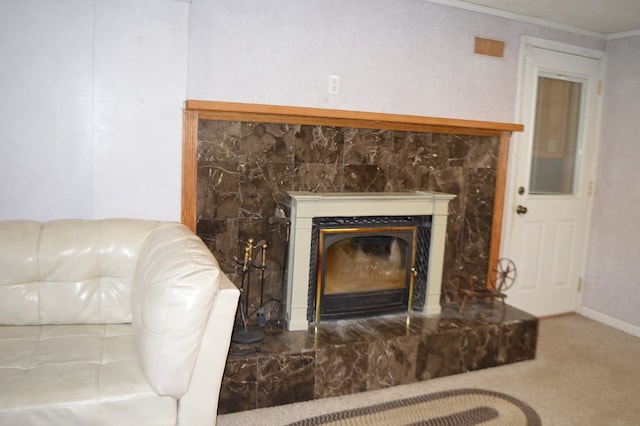 details featuring a fireplace, carpet, and crown molding