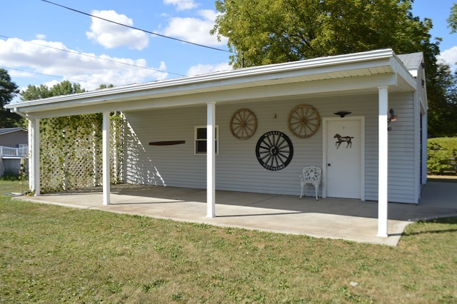 back of property featuring a lawn