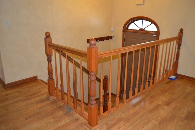 stairway with wood-type flooring