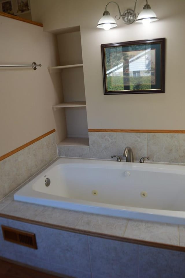 bathroom with tiled tub