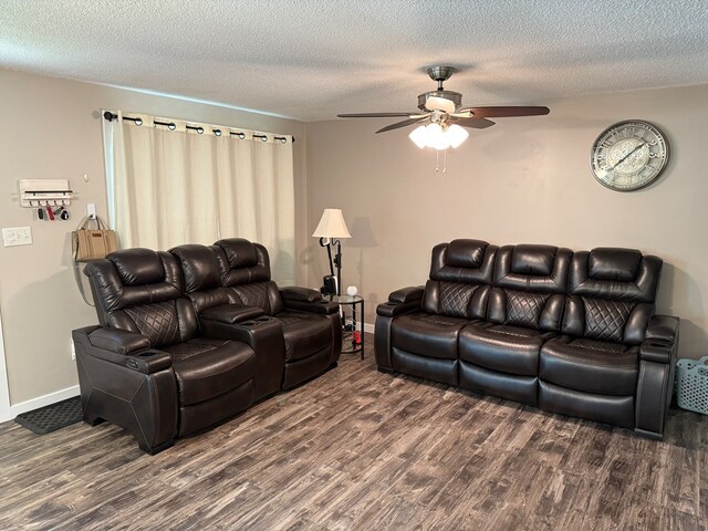 1421 Cullen Ave, Bucyrus, OH 44820 - living room featuring baseboards, wood finished floors, a ceiling fan, and a textured ceiling