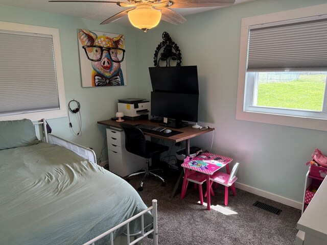 1421 Cullen Ave, Bucyrus, OH 44820 - carpeted bedroom with visible vents, a ceiling fan, and baseboards