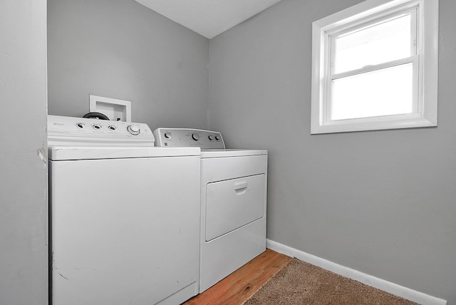 laundry room featuring laundry area, baseboards, and independent washer and dryer