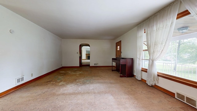120 S Trimble Rd, Mansfield, OH 44906 - unfurnished living room featuring arched walkways and baseboards