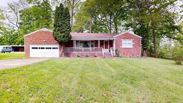 120 S Trimble Rd, Mansfield, OH 44906 - ranch-style home with covered porch, an attached garage, dirt driveway, brick siding, and a front yard