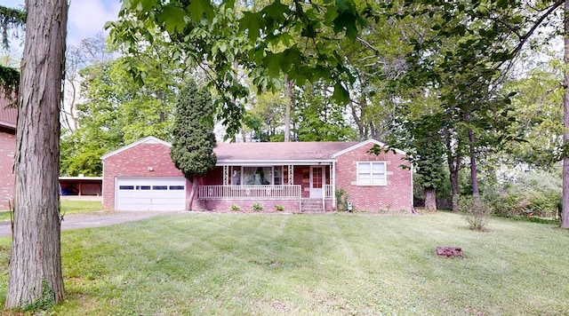 120 S Trimble Rd, Mansfield, OH 44906 - single story home with a porch, brick siding, a front lawn, and a garage