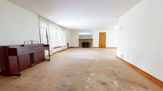 120 S Trimble Rd, Mansfield, OH 44906 - unfurnished living room with baseboards and a fireplace