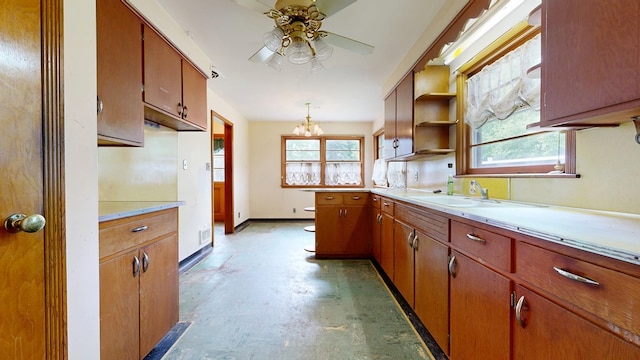 120 S Trimble Rd, Mansfield, OH 44906 - kitchen with concrete floors, ceiling fan, light countertops, a sink, and healthy amount of natural light