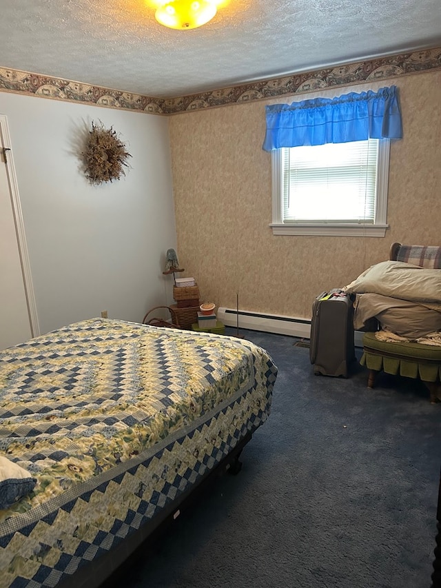 bedroom with a baseboard heating unit, carpet flooring, and a textured ceiling