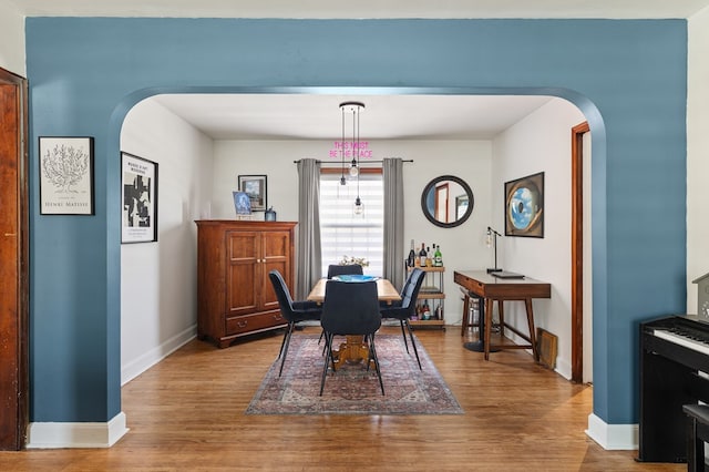 dining room with wood-type flooring