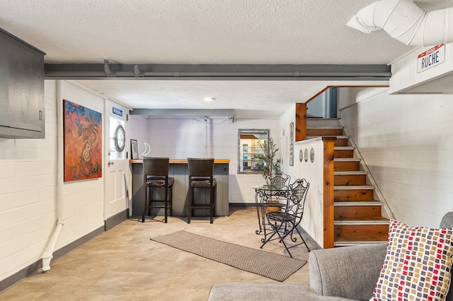 interior space with a textured ceiling