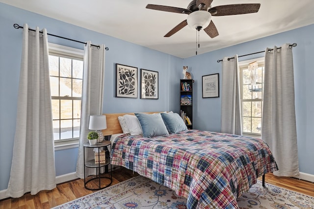 bedroom featuring ceiling fan and hardwood / wood-style flooring