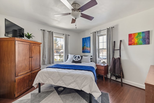 bedroom featuring ceiling fan and dark hardwood / wood-style flooring