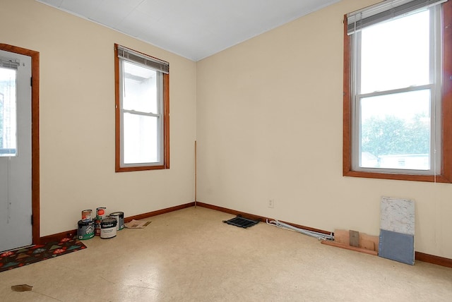 unfurnished room featuring a healthy amount of sunlight