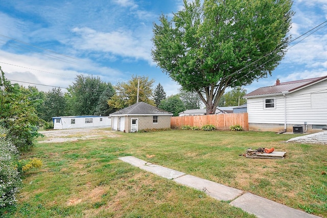 view of yard with cooling unit and an outdoor structure