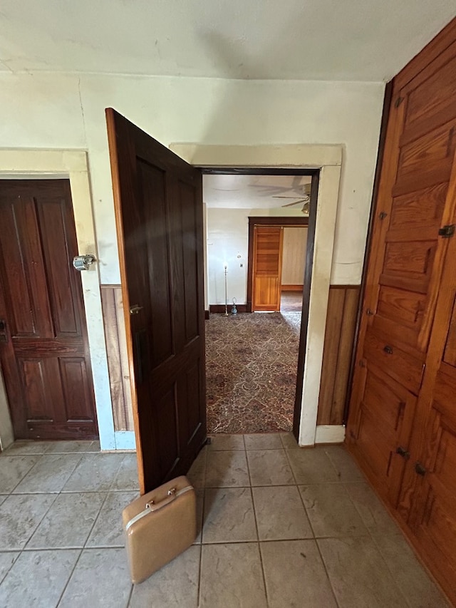 1221 N Sandusky Ave, Bucyrus, OH 44820 - hall with light tile patterned floors and a wainscoted wall