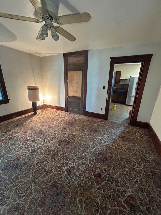 1221 N Sandusky Ave, Bucyrus, OH 44820 - spare room featuring ceiling fan and baseboards