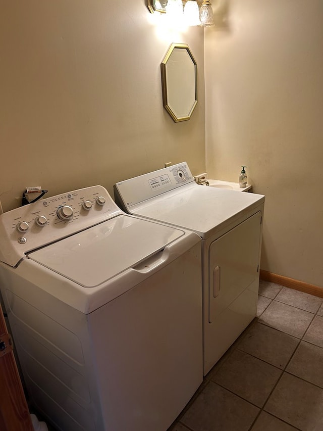 1221 N Sandusky Ave, Bucyrus, OH 44820 - washroom featuring separate washer and dryer and light tile patterned flooring