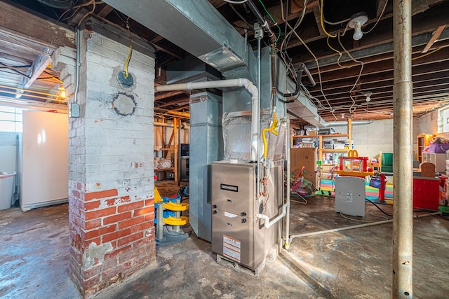 utility room featuring heating unit