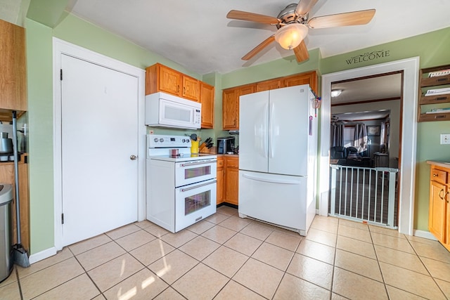 kitchen with ceiling fan, light tile patterned flooring, and white appliances