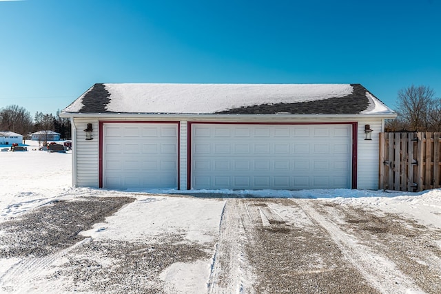 view of snow covered garage