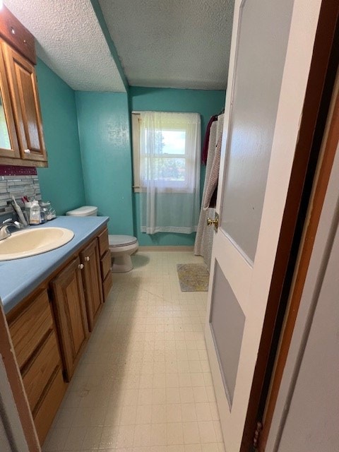 2415 State Route 96, Ashland, OH 44805 - bathroom featuring vanity, a textured ceiling, tile patterned floors, and curtained shower