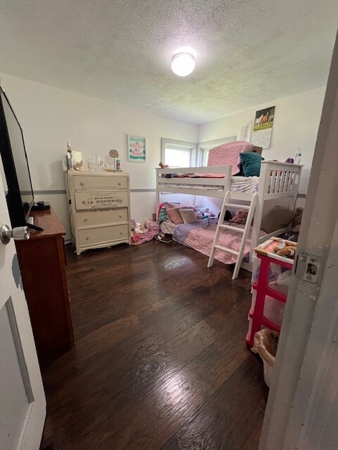 2415 State Route 96, Ashland, OH 44805 - bedroom with wood finished floors and a textured ceiling