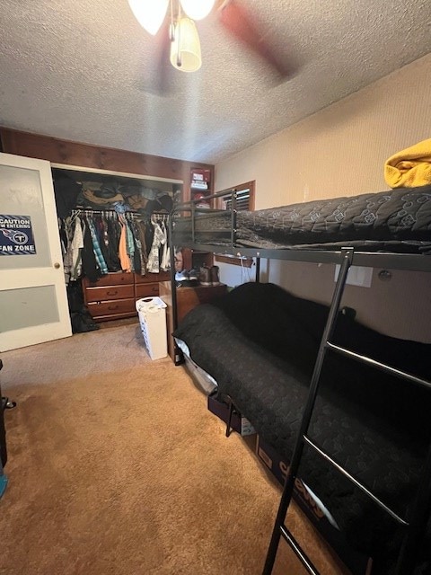 2415 State Route 96, Ashland, OH 44805 - carpeted bedroom featuring a textured ceiling and a ceiling fan
