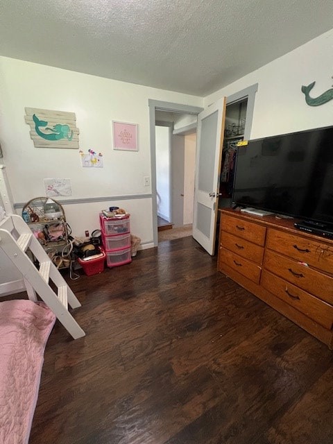 2415 State Route 96, Ashland, OH 44805 - bedroom featuring dark wood-style flooring and a textured ceiling